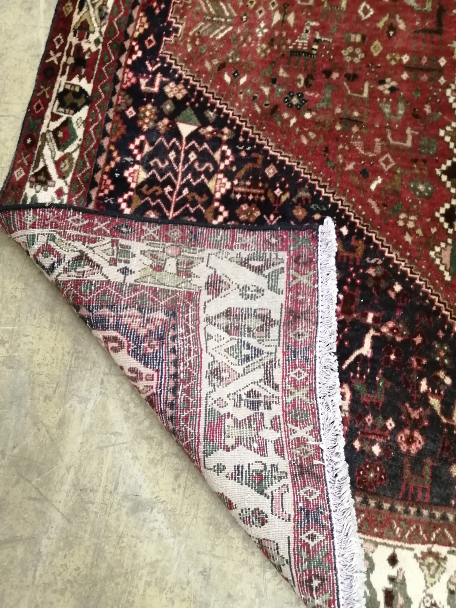 An Abadeh brick red ground carpet, 210 x 155cm